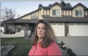  ?? PHOTO BY CINDY YAMANAKA — THE PRESS-ENTERPRISE ?? Amalitsa Anastasiou, 54, says she will fight to keep her Menifee home, after taking out a HERO loan on Jan. 23. Her property tax bill went up by almost $5,000 and was approved for a $40,000 loan beyond her means on her maid’s salary.