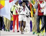  ?? GETTY IMAGES ?? Flag bearer Simone Biles of the United States, who won four gymnastics gold medals, carries the United States flag during the “Heroes of the Games” segment during the closing ceremony of the Olympics on Sunday night in Rio de Janeiro, Brazil. The...