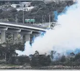  ?? Pictures: MATHEW FARRELL ?? SERIOUS: Fire crews battle the blaze that was visible across Hobart