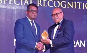  ?? Photo: Karalaini Tavi ?? From left: Permanent Secretary in the Office of the Prime Minister and Sugar Industry, Yogesh Karan. received a special recognitio­n award during the 2018 Fiji Business Excellence Awards from the President Jioji Konrote at the Sheraton Resort Fiji on November 3, 2018.