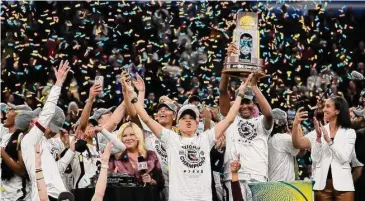  ?? Eric Gay/Associated Press ?? South Carolina head coach Dawn Staley celebrates with her team after beating UConn in the national championsh­ip game last April.