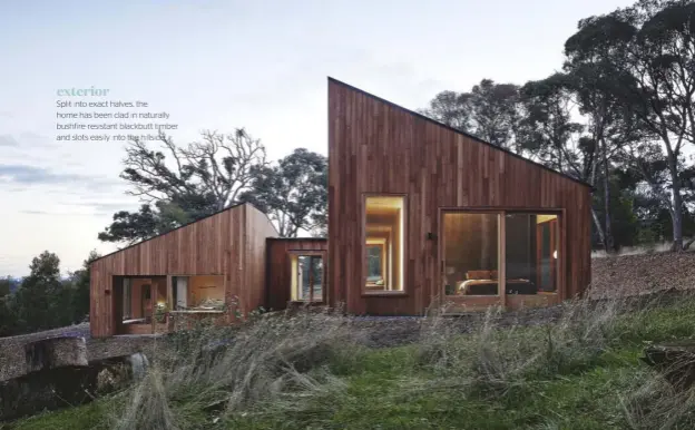  ??  ?? exterior Split into exact halves, the home hash been clad in naturally bushfire-resistant blackbutt timber and slots easily into the hillside.