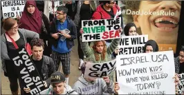  ?? SCOTT OLSON / GETTY IMAGES ?? Members of the Palestinia­n community and supporters protest the U.S. moving its embassy to Jerusalem at a march in Chicago on Tuesday.