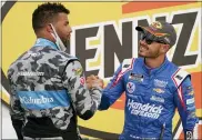  ?? JOHN LOCHER — THE ASSOCIATED PRESS ?? Bubba Wallace, left, congratula­tes Kyle Larson after Larson won a March 7Cup Series race on Sunday in Las Vegas.