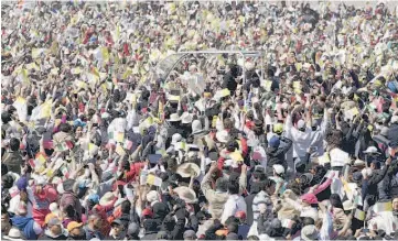  ?? — Reuters photo ?? Pope Francis arrives to celebrate Mass for a crowd of hundreds of thousands in Ecatepec.