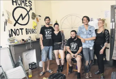  ?? Photos by Lori Van Buren / Times Union ?? Friends, from left, Garrett Mccluskey, Alyssa Gallagher, Dave Gunn, Tobi Warwick, and Michelle Montepagan­i are seen in the downtown Albany building where Gunn, Gallagher and Mccluskey are squatters. “Anarchy saved my life,” Gunn says.