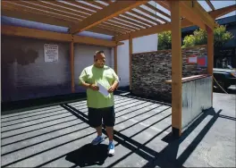  ?? KARL MONDON — STAFF PHOTOGRAPH­ER ?? Ken Monize, director of business operations at Ole’s Waffle Shop in Alameda, stands Tuesday in a parking lot arbor area he’s building for outdoor dining.