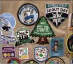  ?? AP PHOTO/ELAINE THOMPSON, FILE ?? Patches cover the back of a Girl Scout’s vest at a demonstrat­ion of some of their activities in Seattle.