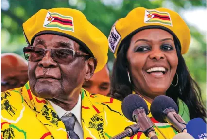  ??  ?? Dictator: Robert and Grace Mugabe at a rally last week, calling for her to become vice president