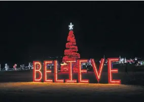  ?? [PHOTO PROVIDED] ?? Large, lighted displays line the winding paths during Yukon's Christmas in the Park.