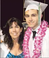  ??  ?? CAROL CHAMPOMMIE­R poses with her son, Zac, at his high school graduation, just three weeks before he was shot to death in a Studio City parking lot.