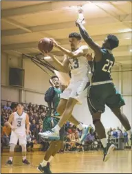  ?? Submitted photo ?? NIGHTHAWKS SOAR: National Park College Nighthawk basketball teams opened the season against the Crowley’s Ridge College Pioneers Monday night in a packed gymnasium. K.J. Corder, center, led the men’s team in scoring with 24 points on the way to a 91-76...