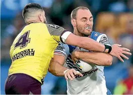  ?? PHOTO: GETTY IMAGES ?? Simon Mannering is tackled by Jack Bird (Broncos) during the NRL match last weekend in Auckland.