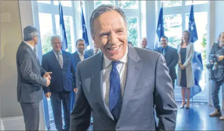  ?? CP PHOTO ?? Quebec Premier-designate Francois Legault leaves after speaking to the media the day after after winning the provincial election Tuesday.