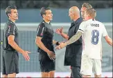  ??  ?? Zinedine Zidane (third from left) was irked as two handball calls went against Real Madrid in their 2-2 draw with Sevilla.