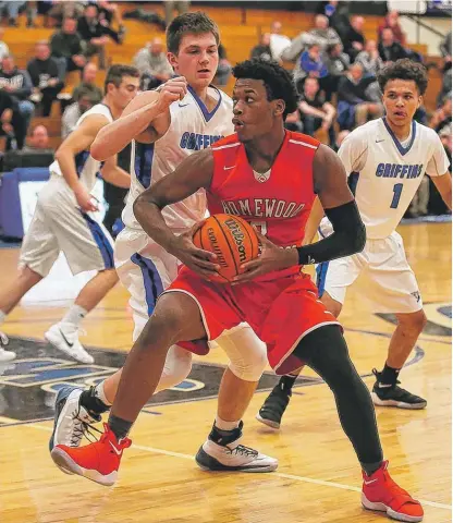  ?? | ALLEN CUNNINGHAM/ FOR THE SUN- TIMES ?? Homewood- Flossmoor junior Issac Stanback keeps the ball away fromLincol­n- Way East’s SamShafer.