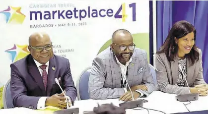  ?? ?? Minister of Tourism Edmund Bartlett (left), President of the CHTA Nicola Madden-greig and director of tourism Donovan White at a press conference held during the 41st staging of the CHTA’S Travel Marketplac­e event held in Barbados May 9-11.