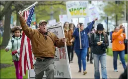  ?? MARK MIRKO/HARTFORD COURANT VIA AP, FILE ?? In this April 27 file photo, opponents of a bill to repeal Connecticu­t’s religious exemption for required school vaccinatio­ns march down Capitol Avenue before the State Senate voted on legislatio­n, in Hartford, Conn.