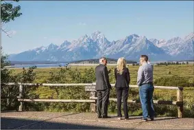  ?? Associated Press ?? Federal Reserve Chair Jerome Powell, left, chats with Federal Reserve Vice Chair Lael Brainard, center, and Federal Reserve Bank of New York president and CEO John Williams, right, at the central bank’s annual symposium in Grand Teton National Park on Friday.