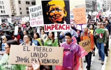  ?? — AFP photo ?? File photo shows demonstrat­ors march to protest Trump’s immigratio­n policies during the ‘Immigrants Make America Great March’ in Los Angeles, California.