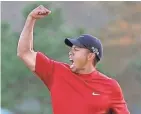  ?? ASSOCIATED PRESS ?? Tiger Woods celebrates winning the 2005 Masters in a playoff with Chris DiMarco at the Augusta National Golf Club in Augusta, Ga.