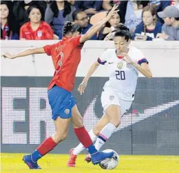  ?? MICHAEL WYKE/AP ?? Costa Rica’s Maria Coto pressures American Christen Press during the United States’ win Monday night in Houston.