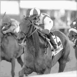  ?? KENNY MARTIN/COGLIANESE PHOTOS ?? Economic Model wins the Grade 3 Hal’s Hope last Saturday.