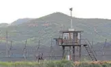  ?? AP ?? South Korean army soldiers patrol the barbed- wire fence along the Demilitari­zed Zone in South Korea’s Paju, near the border with North Korea, on Friday.