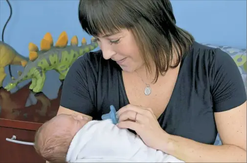  ?? Pam Panchak/Post-Gazette ?? Gevony Williams of Shadyside with her son, Dax, in Austin’s Room in the Pediatric Unit at West Penn Hospital in August.