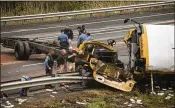  ?? BRYAN ANSELM / THE NEW YORK TIMES ?? Authoritie­s investigat­e the scene where a school bus collided Thursday with a dump truck on I-80 in Mount Olive, N.J., and flipped over onto the median, officials said.