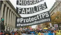  ?? FILE ?? Protesters hold messages in favor of the Temporary Protected Status (TPS) program during a rally on Nov. 9, 2018, in front of the White House in Washington, D.C.