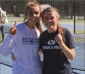  ?? Courtesy photo ?? Emilee Nicholls left and Megan Mayo celebrate after winning the state title for doubles in tennis.