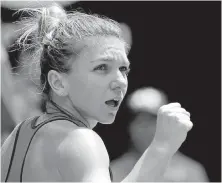  ?? VINCENT THIAN, THE ASSOCIATED PRESS ?? Romania’s Simona Halep celebrates after defeating American Lauren Davis in their third-round match at the Australian Open in Melbourne on Friday.