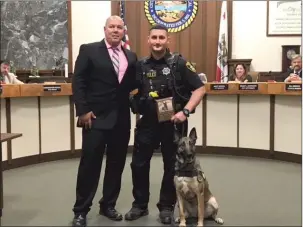  ?? Courtesy photos ?? Marysville Police interim Chief Chris Sachs, left, with Officer Rob Kesterson and Alaska at a City Council meeting.