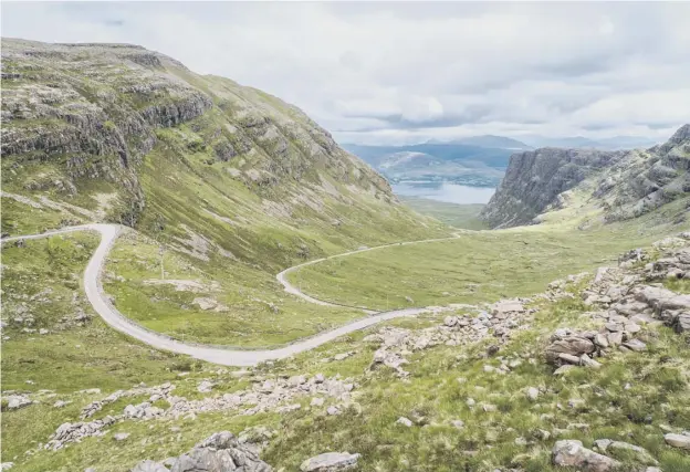  ??  ?? 0 The Bealach na Bà road, which features a series of hair pin bends, is a critical route for those living on the Wester Ross peninsula