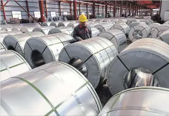  ?? CHINATOPIX VIA THE ASSOCIATED PRESS FILE PHOTO ?? Aluminum from China, seen here, is still a threat to small businesses in Canada, even with the 25 per cent tariff imposed by the United States. Quebec has announced it will help financiall­y support those companies.