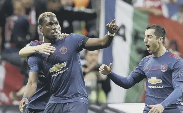  ?? PICTURE: MICHAEL SOHN/AP ?? 0 Paul Pogba celebrates with Matteo Darmian and Henrikh Mkhitaryan, right, after scoring the opening goal in 18 minutes in Sweden last night.