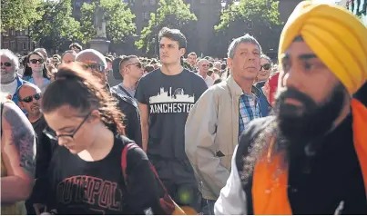  ?? Picture: Getty. ?? People congregate to attend a vigil in Albert Square in Manchester, in solidarity with those killed and injured in the terror attack at the Ariana Grande concert at Manchester Arena.