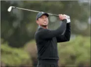  ?? RICHARD SELLERS — PA VIA AP ?? Tiger Woods of the US in action during preview day two of The Open Championsh­ip 2018at Carnoustie Golf Links in Angus, Scotland, Monday.