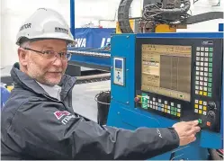  ??  ?? Top: the new Forth Drummer has entered service. Above: project manager Mark Wilbourne presses the button to start steel cutting for the new generation of Woolwich ferries at Rementowa’s Gdansk yard.