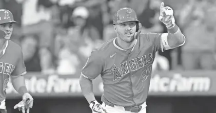  ?? JAYNE KAMIN-ONCEA/USA TODAY SPORTS ?? Los Angeles Angels outfielder Mike Trout celebrates after hitting a two-run home run in the first inning against the Tampa Bay Rays on April 9 at Angel Stadium.