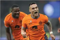  ?? LUCA BRUNO — THE ASSOCIATED PRESS ?? Inter Milan's Lautaro Martinez, right, celebrates with his teammate Marcus Thuram after scoring his side's second goal during the Serie A soccer match between Inter Milan and Salernitan­a at the San Siro stadium in Milan, Italy, on Feb.16, 2023.