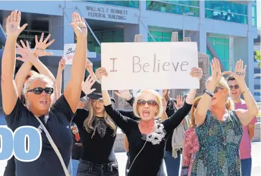  ?? RICK BOWMER/ASSOCIATED PRESS ?? Protesters shout during a rally against the confirmati­on of Brett Kavanaugh at the Wallace F. Bennett Federal Building in Salt Lake City on Thursday.