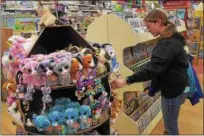  ?? PETE BANNAN-DIGITAL FIRST MEDIA ?? A customer shops at Learning Express Toys in the Exton Mall. The store is moving back to its original location at 128 Eagleview Blvd. in Uwchlan, effective April 6.