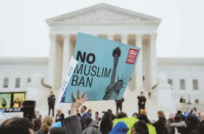  ?? AP PHOTO ?? SUPPORT FOR MUSLIMS: Opponents of President Trump’s travel ban rally yesterday outside the Supreme Court, where justices heard arguments about whether the ban is constituti­onal.