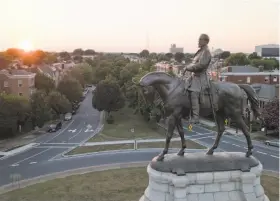  ?? Steve Helber / Associated Press 2017 ?? Confederat­e Gen. Robert E. Lee, whose statue sits on Monument Avenue in the city of Richmond, is honored by the Virginia Legislatur­e each year.