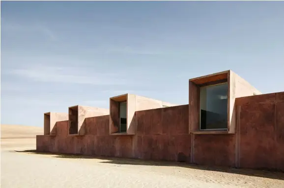 ??  ?? ABOVE: As site-sensitive as a building can get, Museo Paracas, an archaeolog­ical museum built of reddish pozzolan cement, is of a piece with both its desert setting and the ancient ceramics inside.