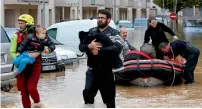  ?? Reuters ?? Rescue workers evacuate residents from a neighbourh­ood in the aude district of Trebes, France. —