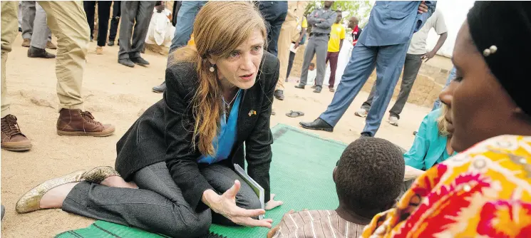  ?? ANDREW HARNIK / THE ASSOCIATED PRESS FILES ?? Former U. S. Ambassador to the United Nations Samantha Power, here meeting with a family last year who fled to Mokolo, Cameroon to escape Boko Haram, argued the U. S. had a special responsibi­lity to protect potential victims of genocide.