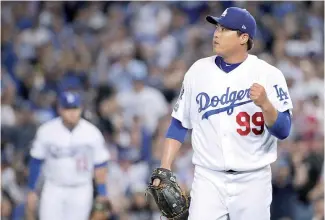  ?? AP ?? Hyun-Jin Ryu lanzó siete dominantes entradas anoche para los Dodgers.